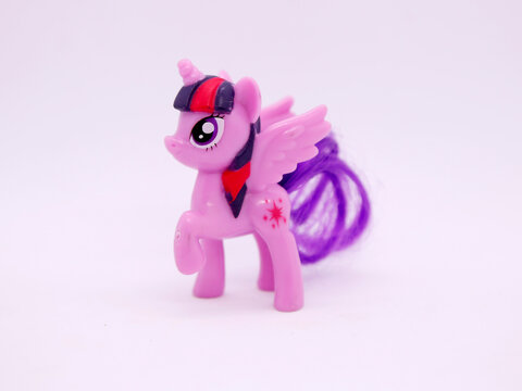 My Little Pony.  Twilight Sparkle. Friendship is Magic. Purple and red pony. Ponipegasus. Pegasus.  Isolated white. TV, movies, shows. Toys for girls and boys. 