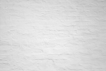White monochrome shabby brick wall background, old stone brickwork plaster texture, grunge clean stucco wall