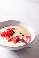 Fresh healthy breakfast greek yogurt with blood oranges, cashew butter and chia seeds