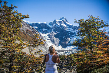 woman taking pictures in the mountains