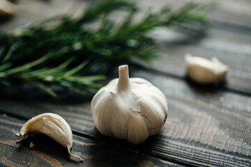 Rosemary and garlic on a wooden table