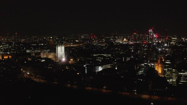Night drone shot towards Westminster abbey birdcage walk vauxhall London