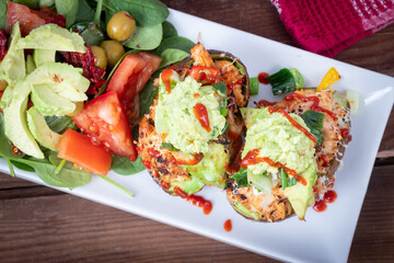 stuffed avocado with pulled pork and side salad