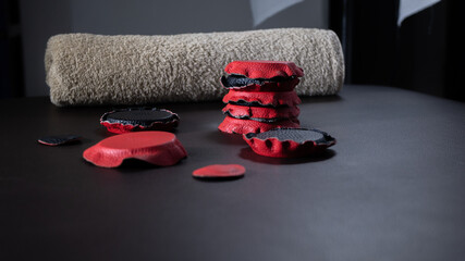 Red and black holistic medicine or alternative medicine biomagnetism magnets placed on a health...