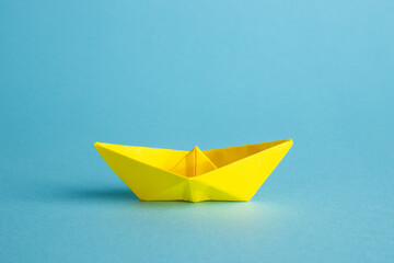 Yellow paper boats concept for leadership, teamwork and winning success