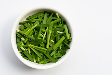 Fresh Chinese Chive leaves on white.