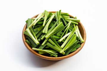 Fresh Chinese Chive leaves on white.