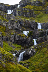 Klifbrekkufossar waterfall in Mjoifjordur, East Fjords, Iceland.
