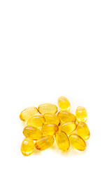 Shiny yellow fish oil capsules isolated on a white background. Vitamin E. Copy space for your text
