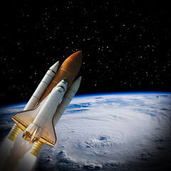 Naklejka premium Rocket above earth. The elements of this image furnished by NASA.