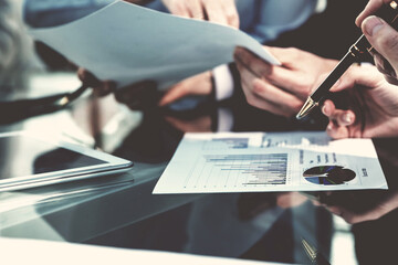 close up. business colleagues checking financial charts.