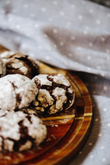  a plate of cakes, only from the oven, sprinkled with powdered sugar