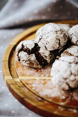  a plate of cakes, only from the oven, sprinkled with powdered sugar