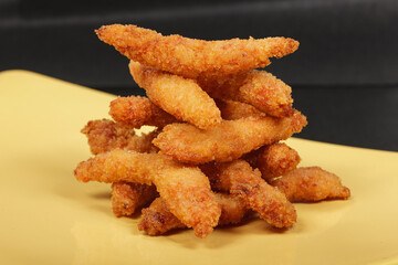 chicken sticks with cinnamon cooked on a wok