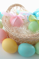 colored and decorated eggs for easter breakfast in italy on white background
