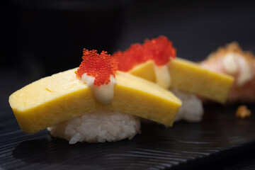 Tamago Sushi with mayonnaise topping and salmon roe.