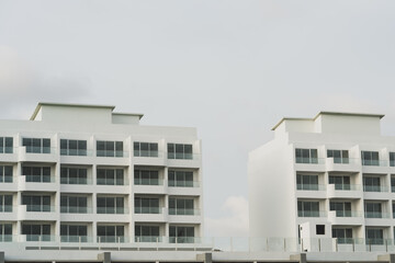 Newly built condominiums. Stylish exterior apartment photographed in a minimalist style.