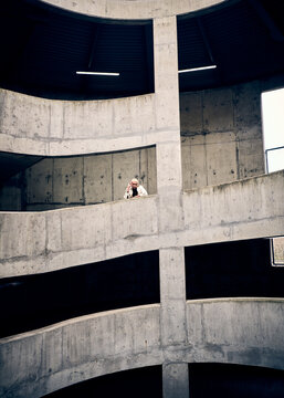 male fashion model posing in a concrete city carpark 