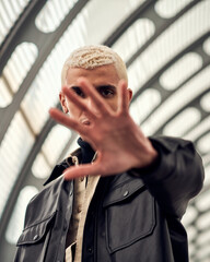 male fashion model posing in city