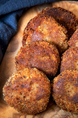 Juicy homemade cutlets on a wood board background