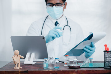 Doctors or scientists are experimenting with the science of a vaccine to treat COVID-19 with a laptop, work in a lab or hospital. The concept of doing it with new and normal technology.