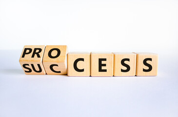 Success process symbol. Turned wooden cubes and changed the word 'success' to 'process'. Beautiful...