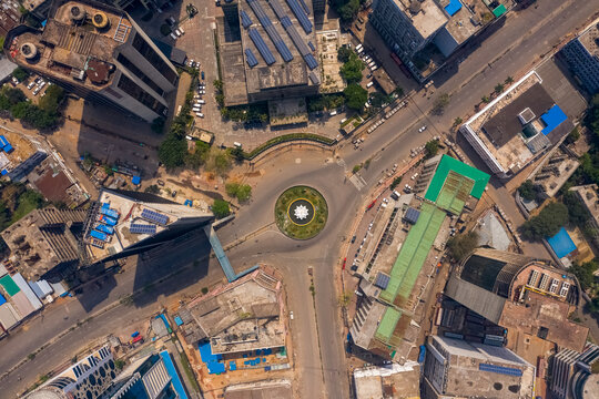 Aerial view of a roundabout with a lily point water fountain during Covid-19 lockdown, empty road in Dhaka, Bangladesh.