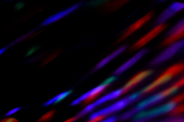 Blur colorful neon light leaks on black background. Defocused illuminated abstract futuristic...
