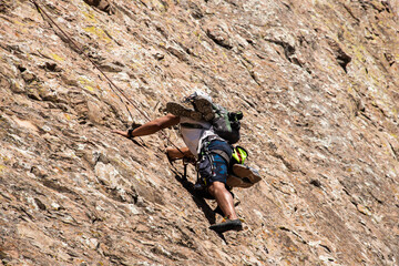 Obraz premium A rock climber on Peña de Bernal, UNESCO site and one of the world’s largest monoliths, Queretaro, Mexico