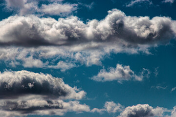 Beautiful blue sky and white cirrus clouds. Background. Texture. Scenery. Material for design.