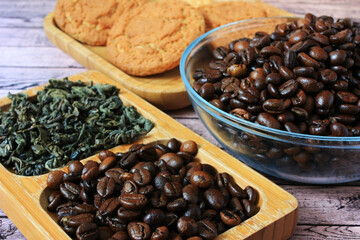 Brown coffee beans lie on a plate