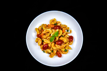 Delicious classic Italian spaghetti with tomato sauce, Parmesan cheese and mint leaves on a plate. There is a writing area.