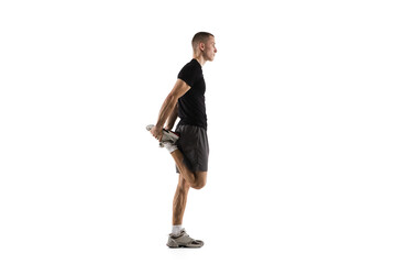 Naklejka premium Stretching. Young caucasian male model in action, motion isolated on white background with copyspace. Concept of sport, movement, energy and dynamic, healthy lifestyle. Training, practicing. Authentic