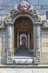 Fototapeta na wymiar View through a row of shrines, Pashupatinath Temple complex, Unesco World Heritage Site, Kathmandu, Nepal