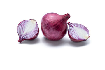 Red whole onion with two cut slices isolated on a white background