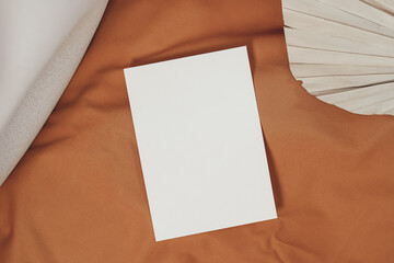 White piece of paper interior with mustard-colored fabric
