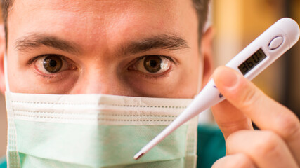 Doctor with mask and thermometer in Italy
