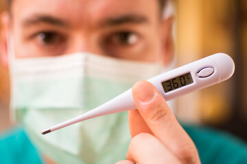 Doctor with mask and thermometer in Italy