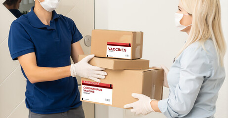 medical worker accepting delivery of covid-19 vaccines from deliveryman