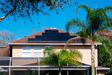 Solar panel on a house roof; Green energy from sun	