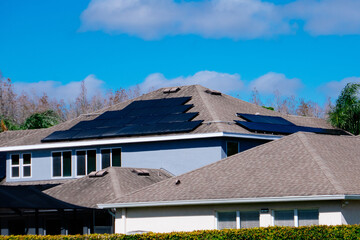 Solar panel on a house roof; Green energy from sun	