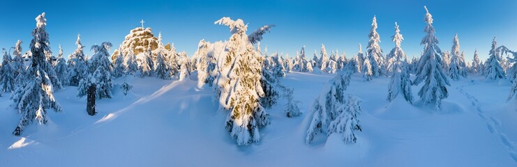 Panoramic landscape of Jizera Mountains, view from peak Izera with frosty spruce forest, trees and...