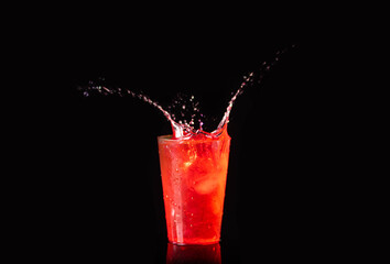 Splash drink cocktail,  black background 