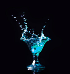 Splash drink cocktail,  black background 