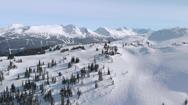 Aerial drone footage of Whistler mountain, BC, ski hill on a sunny day. 4K 24FPS.