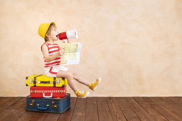 Happy child dreaming about summer vacation and travel