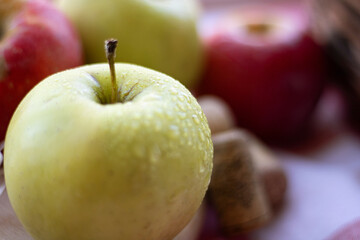 Ripe red apples on the table close up