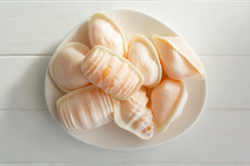 Typical portuguese sweet called Ovos Moles de Aveiro in white wooden table with copy space
