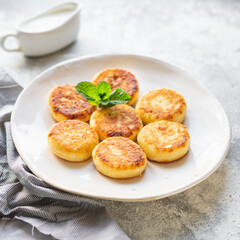 cheesecakes breakfast or dessert syrniki curd cottage cheese pancakes healthy meal top view copy space for text food background rustic image