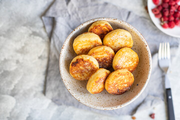 cheesecakes breakfast or dessert syrniki curd cottage cheese pancakes healthy meal top view copy space for text food background rustic image